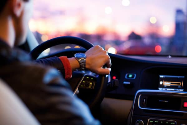 Man driving a car at night