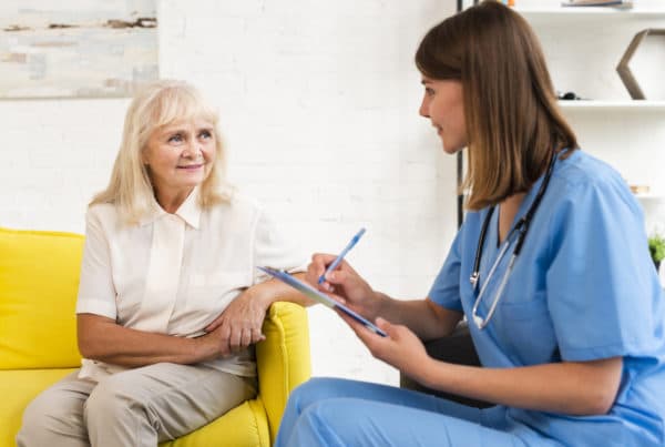 Nurse with senior lady in home