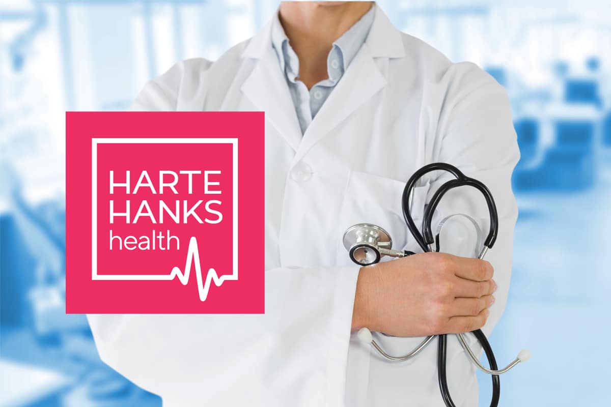 Harte Hanks Healthcare logo with doctor in background