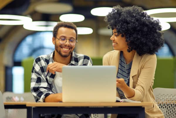 Kyndryl Lead Generation, two African American people sitting with laptop