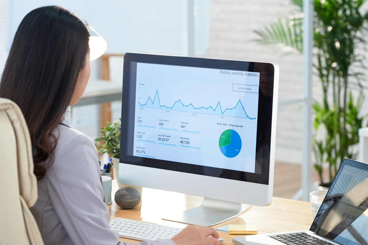 Woman looking at data on computer