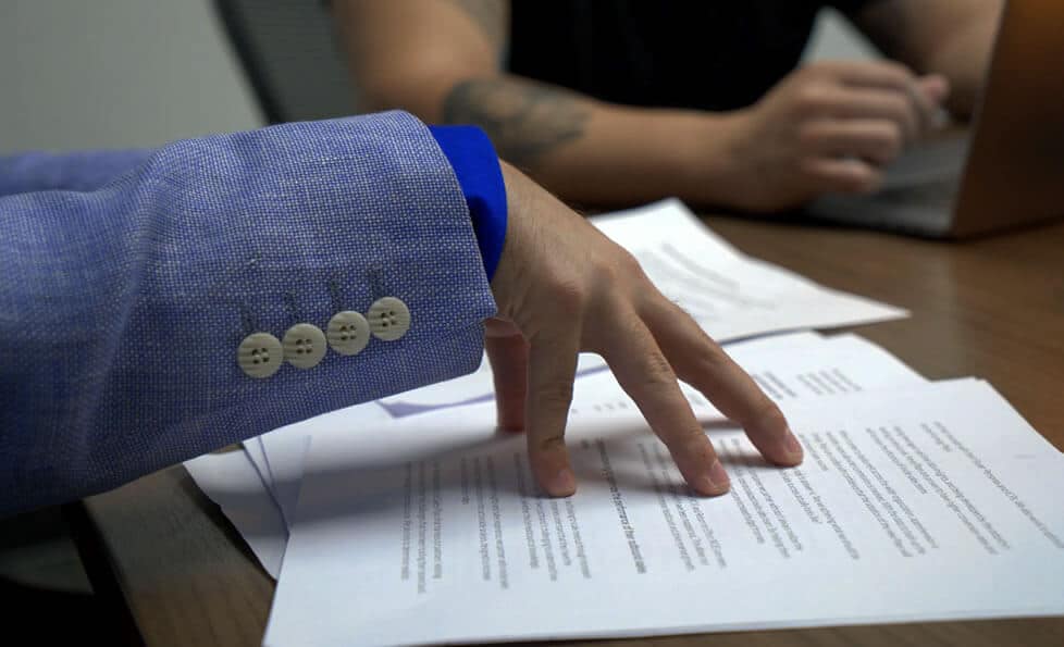 Explore powerful sales play development strategies to penetrate new markets. This image captures a close-up of a professional discussing how to leverage sales development services and sales play expertise to drive growth and success in new territories. The focus is on implementing optimized sales messaging to scale revenue through outsourced sales development and to expand into untapped markets.