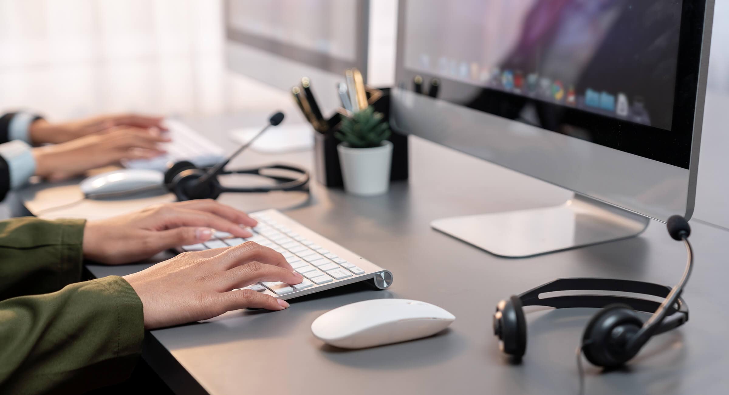Hands typing on a keyboard, representing efficient customer service outsourcing services. This image highlights the operational excellence of outsourced call center services, emphasizing seamless digital processes and support. Companies looking for customer care outsourcing, customer service outsourcing solutions, and contact center outsourcing companies can achieve cost-effective scalability and customer satisfaction by partnering with top customer service outsourcing companies like Harte Hanks. It’s a visual representation of modern outsourcing, bridging technology and human service to provide unmatched customer care for businesses in any industry.