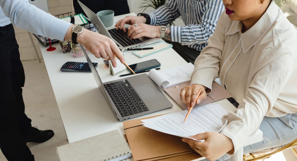 A close-up of professionals planning account based marketing services strategies, highlighting expertise in targeting and retaining A-list clients.