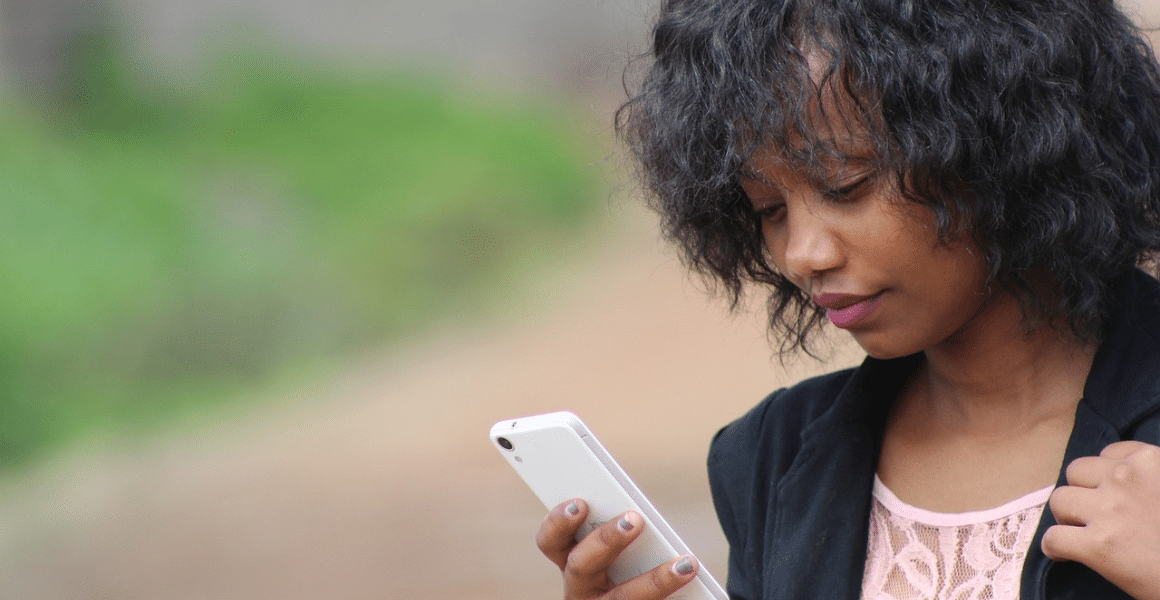 Woman using self-servicing while on-the-go