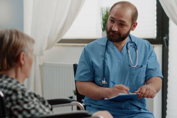 Senior Patient Talking To Nurse