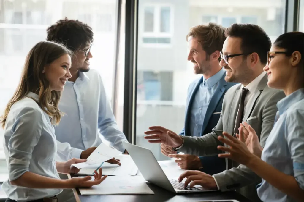 Tech partner meeting for strategic collaboration, CRM optimization, and marketing strategies. Business professionals discussing customer service and data-driven solutions.