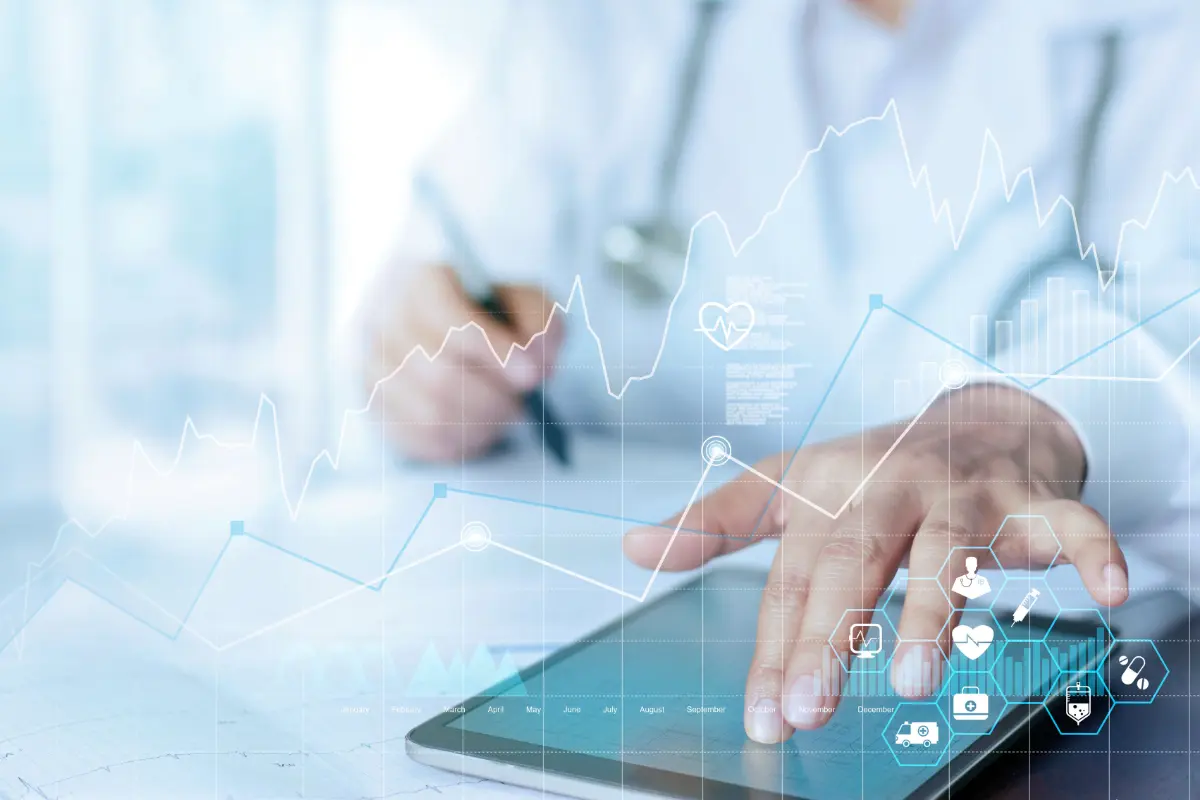 Healthcare professional reviewing data on a tablet, representing the impact of data analytics in healthcare, with a focus on how healthcare data analytics companies are transforming the industry. The image emphasizes the integration of data analytics in pharmaceutical industry for improved decision-making.